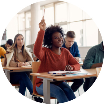 a woman in class raising her hand