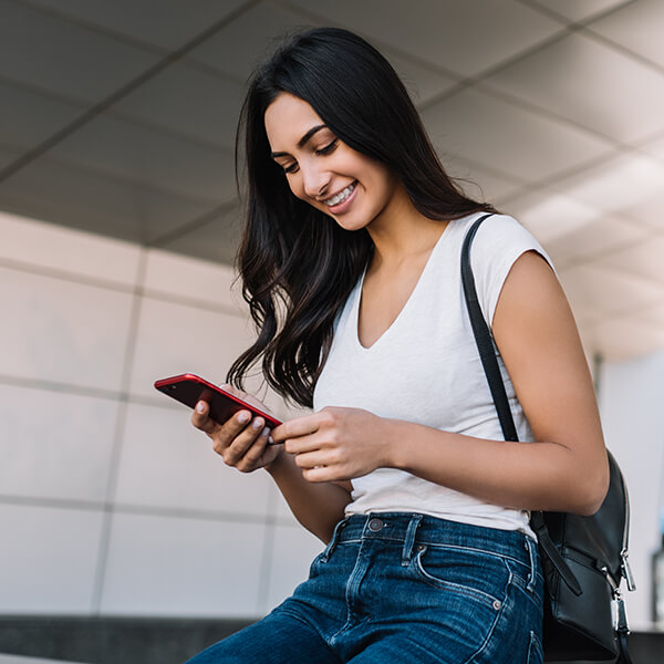 a woman doing mobile banking on her phone