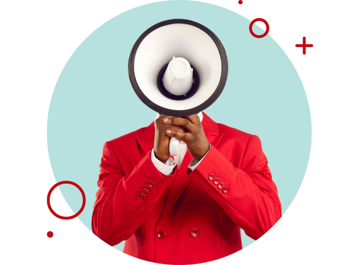 Man in red suit holding a megaphone in front of his face