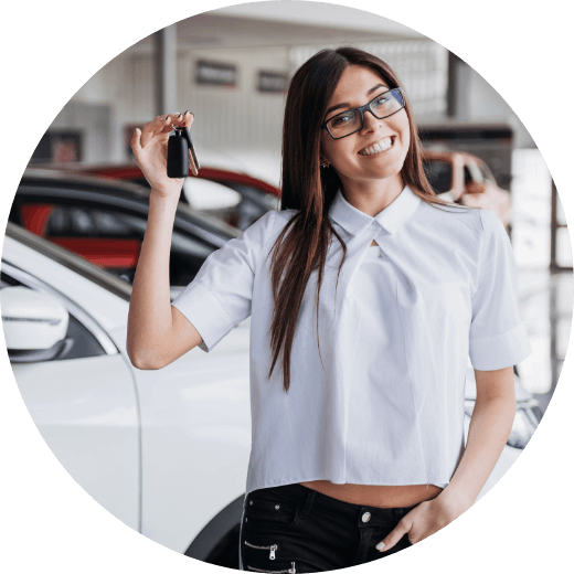 a woman with keys to a new car.