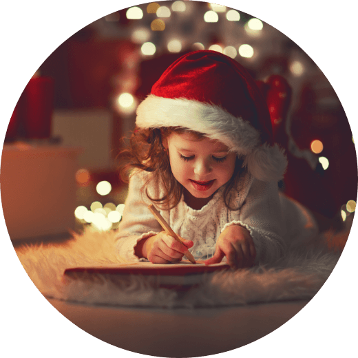 a little girl writing a letter to santa