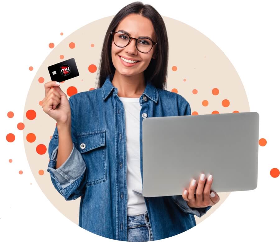 a woman holding her credit card in one hand and her laptop in the other hand