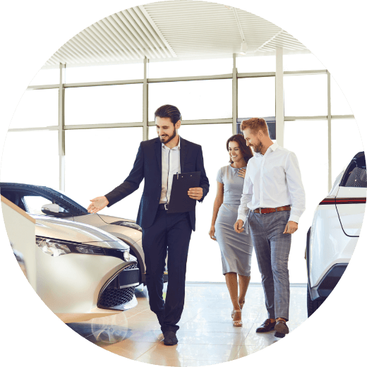 a car salesman showing customers a car