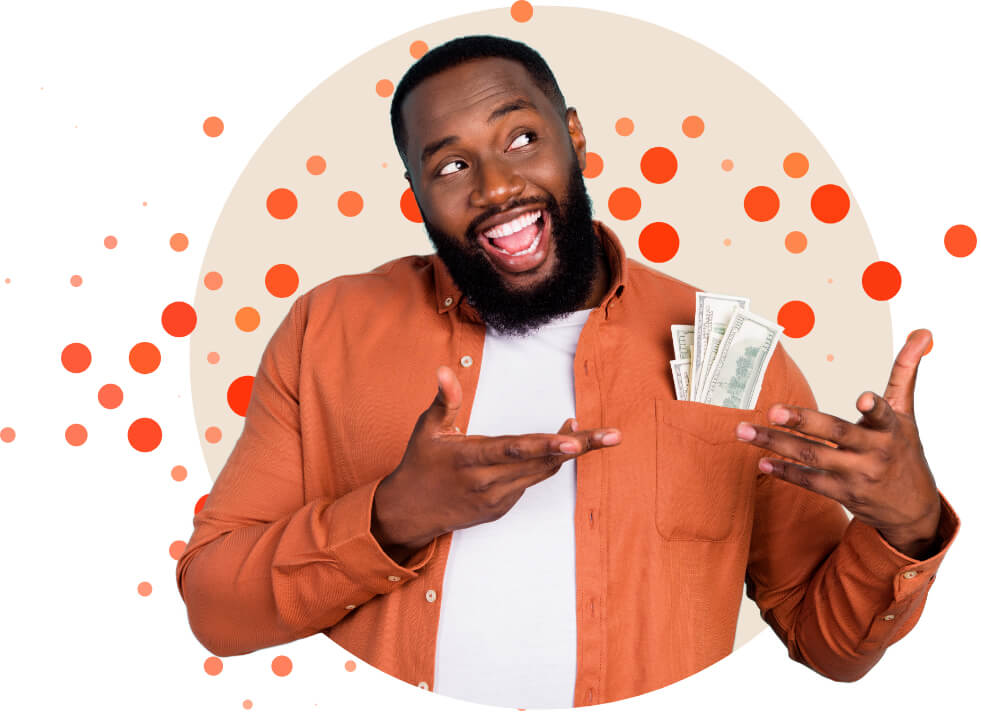 a man smiling with cash in his breast pocket