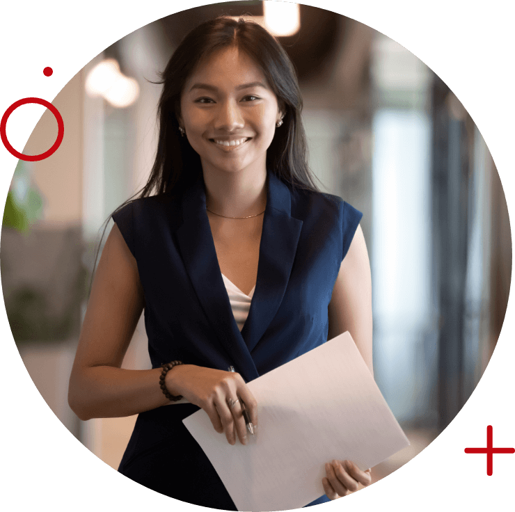 a woman smiling holding a document